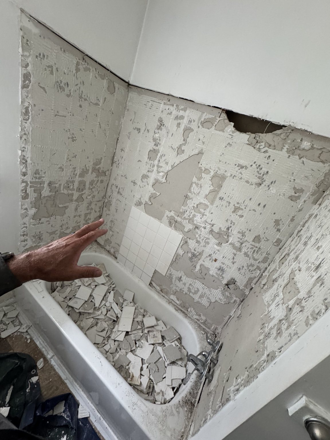 Bathroom tile demolition during renovation